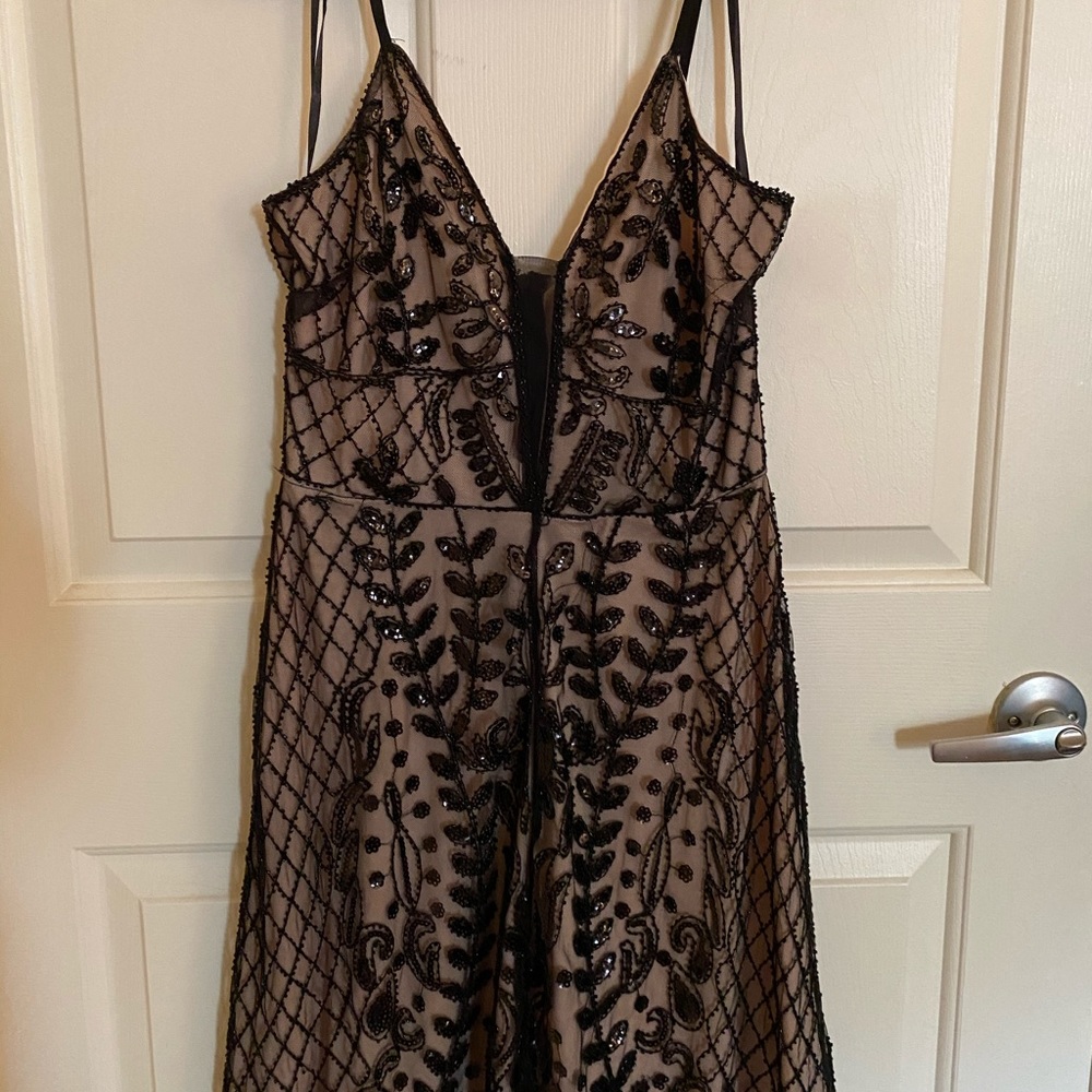 Black and Tan mini dress with beaded overlay.